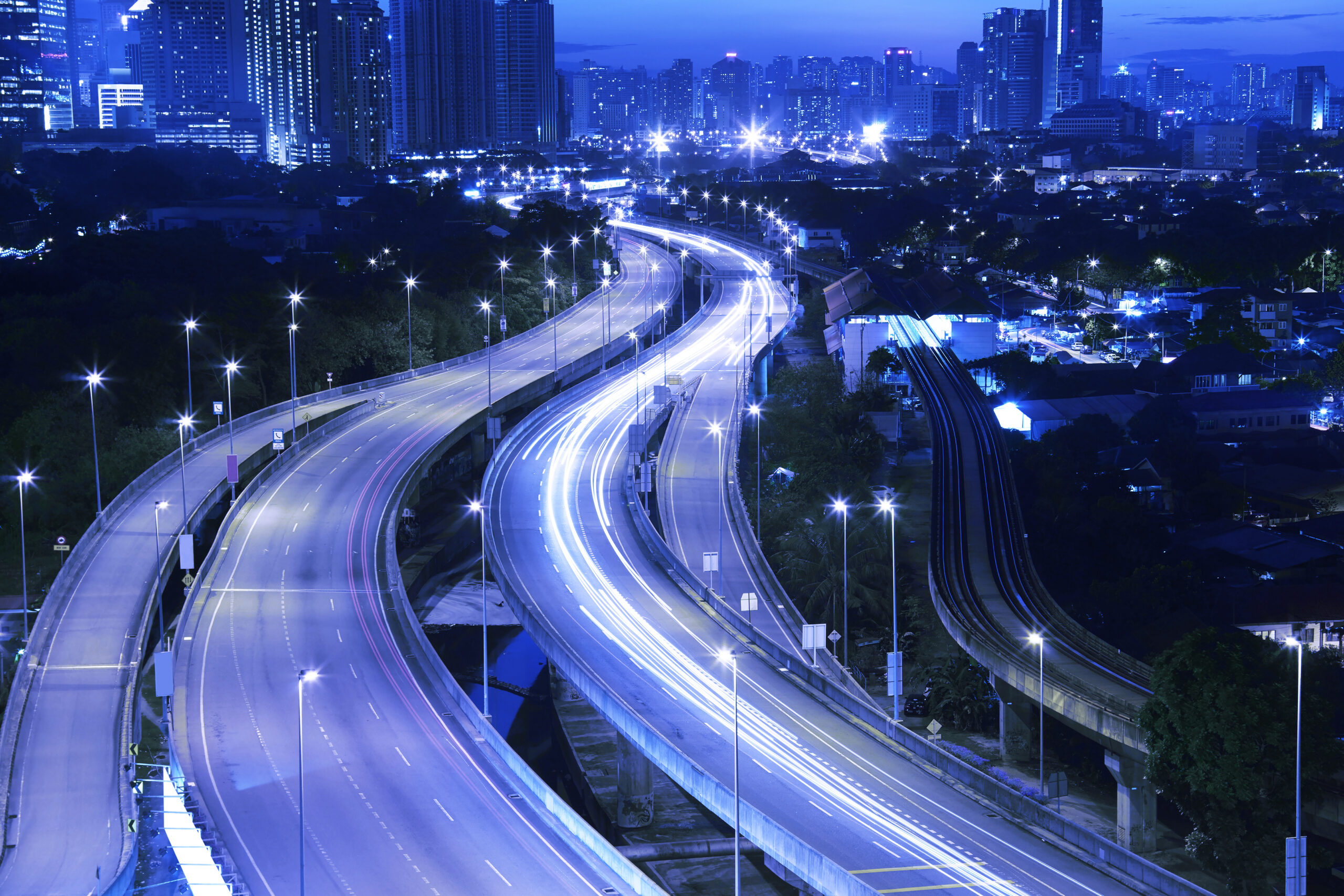 graphicstock-kuala-lumpur-with-stunning-light-trail-from-the-busy-highway-traffic_SdRrv3vlsl