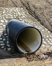 a new modern plastic culvert under the highway